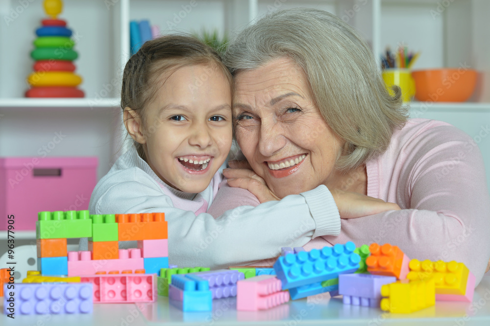 Grandmother with granddaughter playing together Grandmother with granddaughter playing together