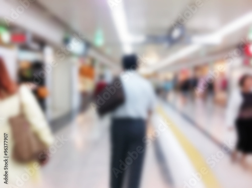 Abstract blurred people walking in shopping center © amnat11