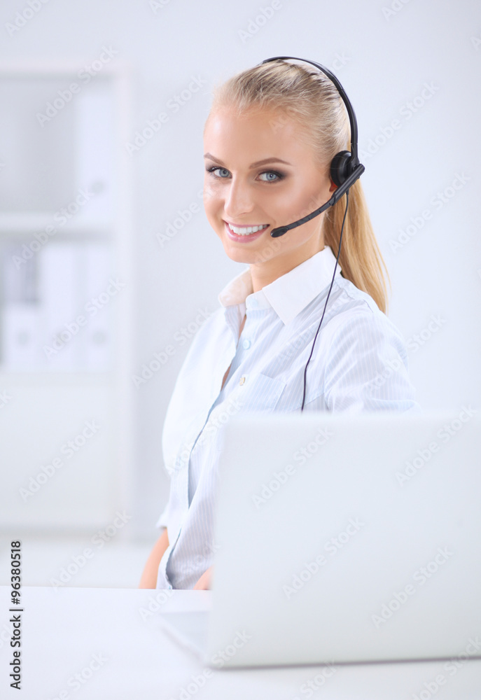 Portrait of beautiful businesswoman working at her desk with he Portrait of beautiful businesswoman working at her desk with he