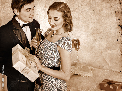 Couple with gift box.  Black and white retro. photo