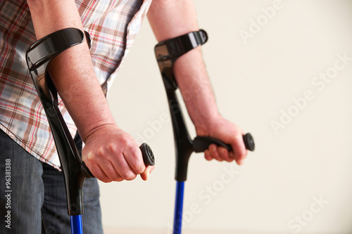 Fototapeta Close Up Of Man Using Crutches