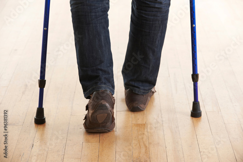 Slika na platnu Close Up Of Man Using Crutches