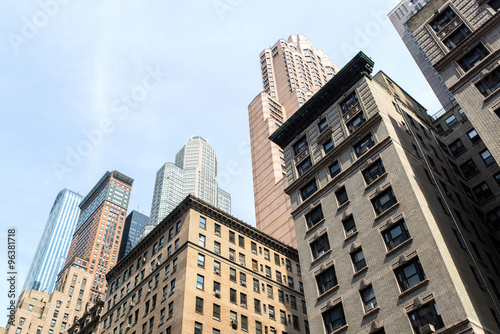 view from bottom of some buildings in the midtown of manhattan in new-york city photo