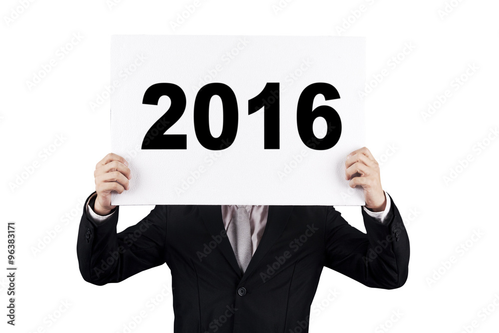 Entrepreneur covering his face with number 2016 Entrepreneur covering his face with number 2016