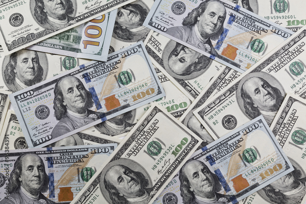 pile of one hundred dollars new and old design as background pile of one hundred dollars new and old design as background