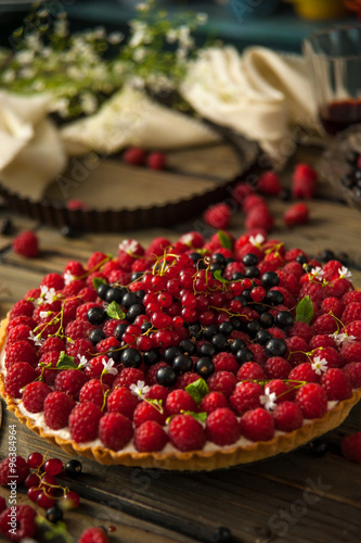 Beautiful and delicious berry tart is on the table