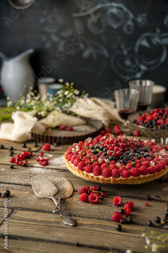 Beautiful and delicious berry tart is on the table