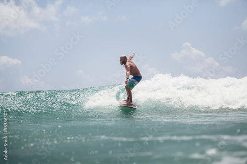 surfer man surfing on waves splash actively