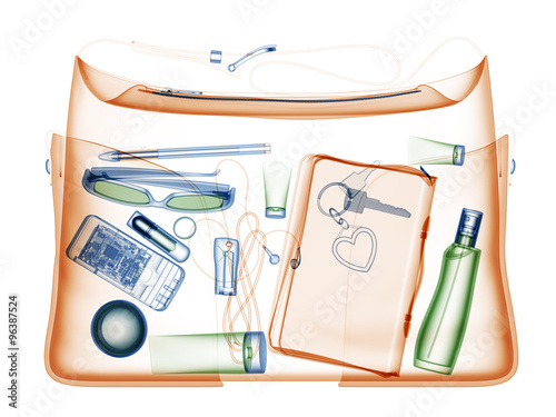 Woman hanbag under xray on security control.