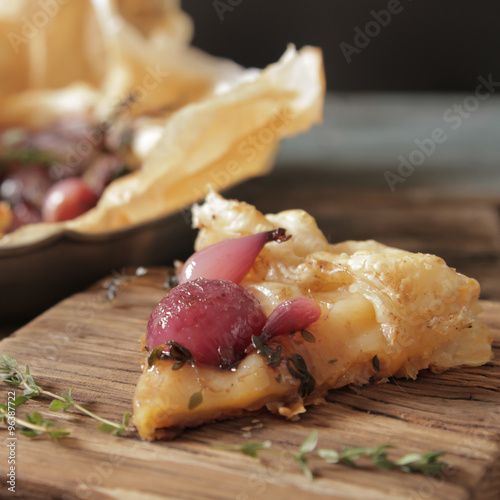 zwiebelkuchen of small red onions and thyme