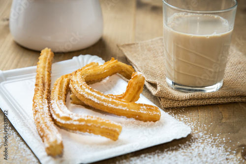 Churros with coffee with milk and sugar