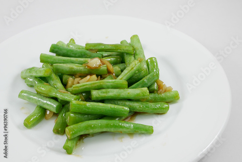 Thai style stir fried green beans on white plate. (1)