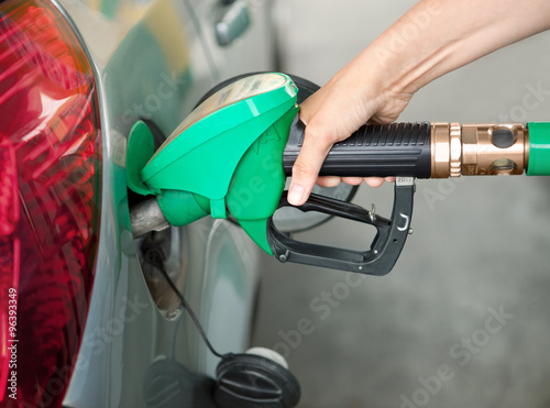 a Arm Refueling the Car at a Gas Station