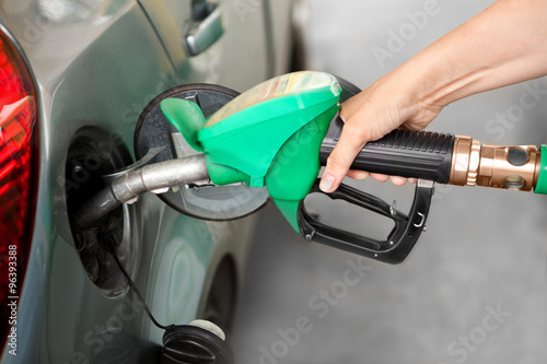 a Arm Refueling the Car at a Gas Station