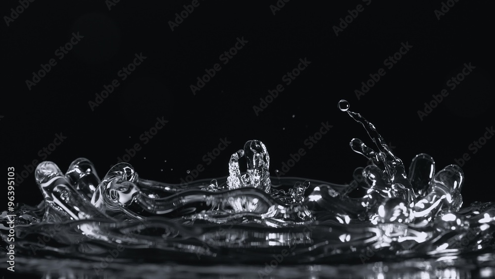 Water surface bouncing and making splash and ripple. Shot with high ...
