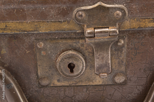 Rusty, dusty lock on an old suitcase