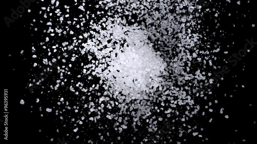 Sea salt exploding against black background. Shot with high speed camera, phantom flex 4K.  Slow Motion. 