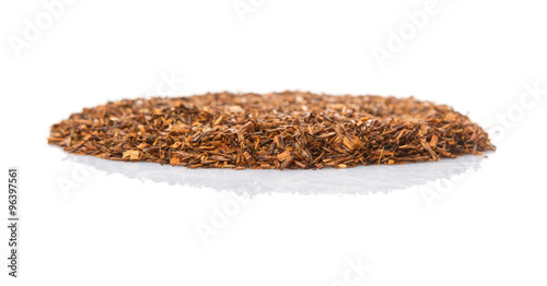 Dried rooibos herbal tea leaves over white background