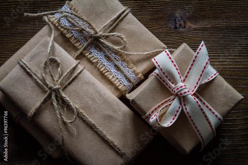 Presents in rustic wrap, wood background