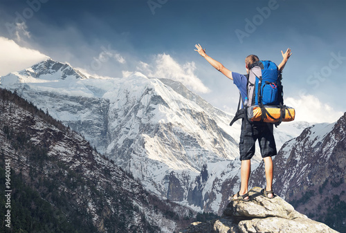 Tourist on mountain peak. Sport and active life concept.