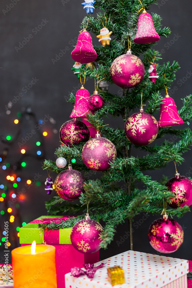 Decorated Christmas tree on blurred, sparkling and fairy backgro