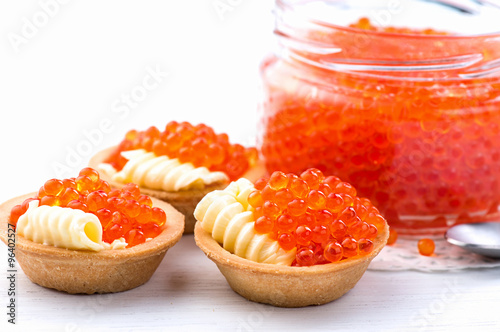 Tartlets with red caviar closeup. Gourmet food