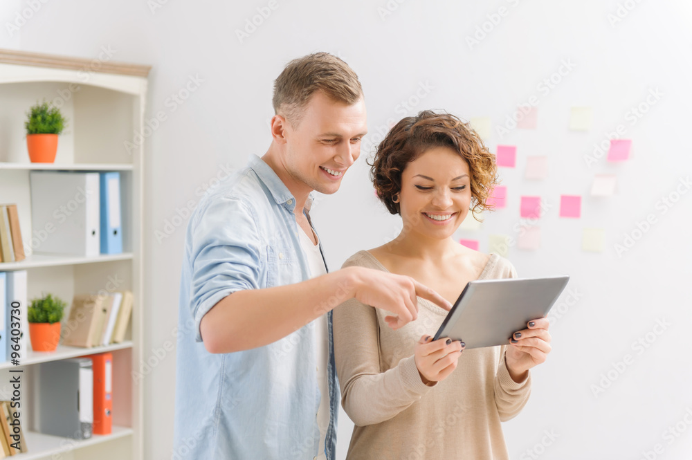 Two colleagues are working with portable tablet. Two colleagues are working with portable tablet.