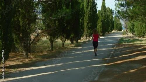 Wallpaper Mural Young woman running in the park at the alley Torontodigital.ca