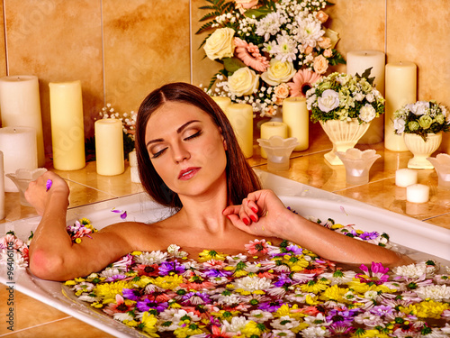 Woman applying moisturizer.