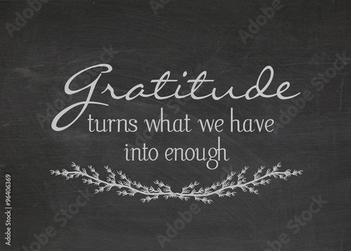 gratitude quote on dusty black chalkboard