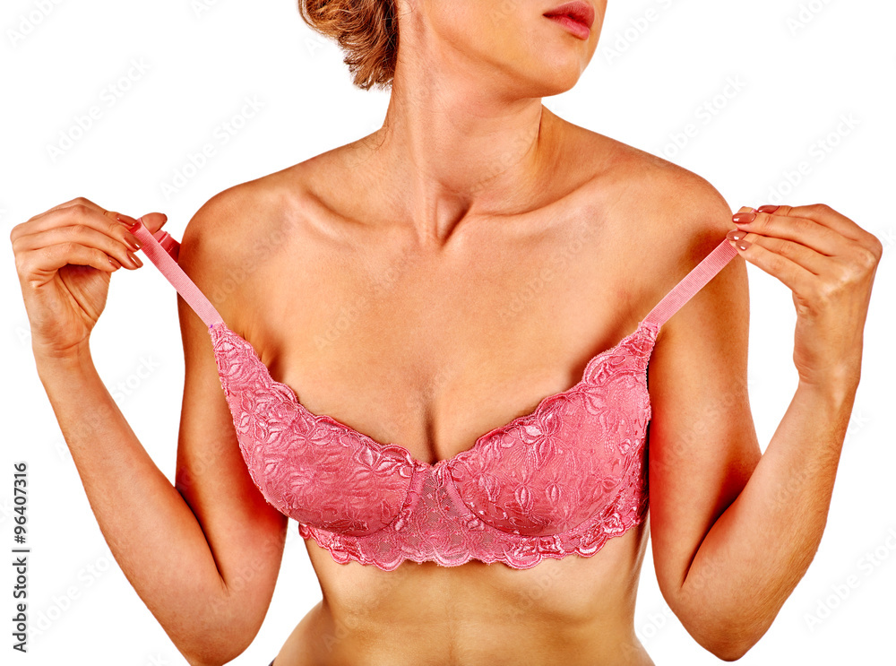 Woman wearing lingerie is taking off bra. Stock Photo