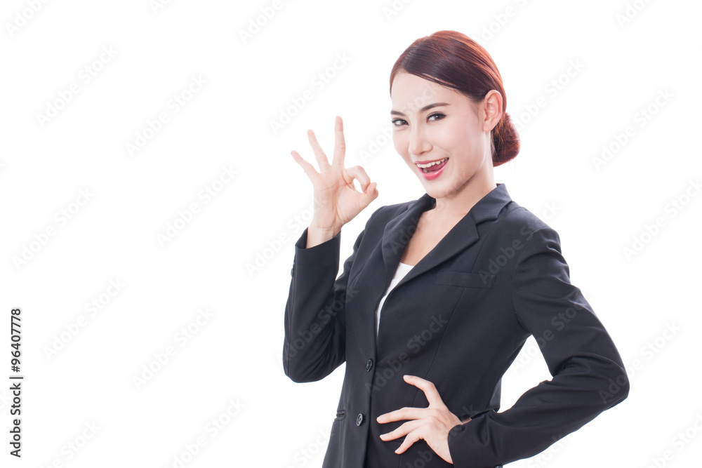 Beautiful business woman showing ok sign on white background Beautiful business woman showing ok sign on white background