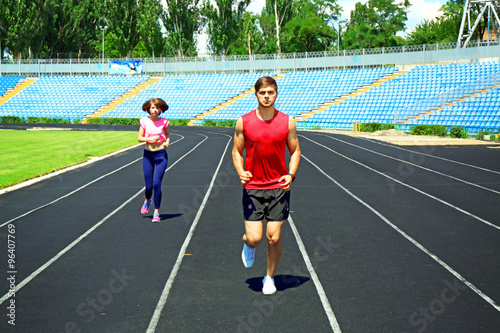Young people jogging on sta...
