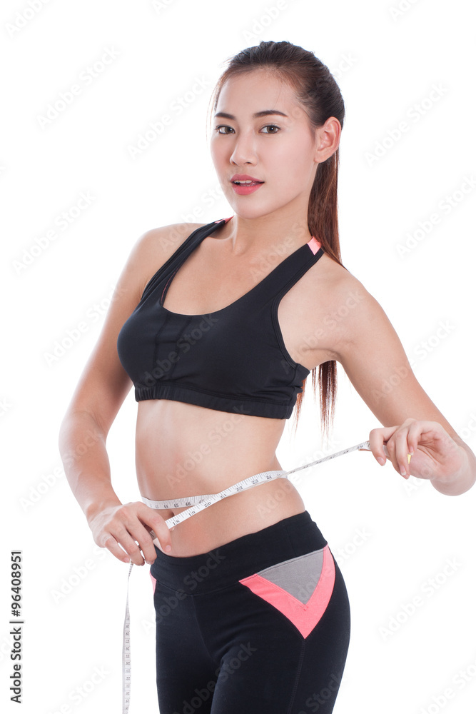 Fitness young woman holding a bottle of water and an apple over white background Fitness young woman holding a bottle of water and an apple over white background