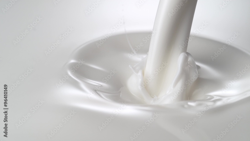 Close-up milky liquid being poured. Shot with high speed camera, phantom flex 4K.  Slow Motion. 