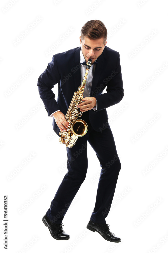 Naklejka premium Young man playing on saxophone isolated on white