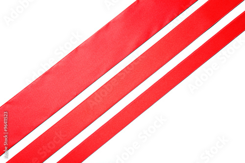 Obraz na płótnie three red diagonal ribbons, isolated on white