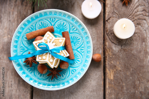 Cookies with spices and Christmas decor, on wooden table