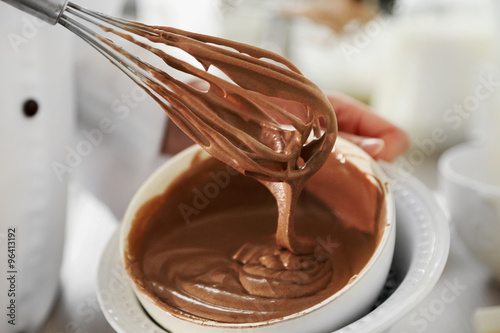 Cooking chocolate cream on kitchen