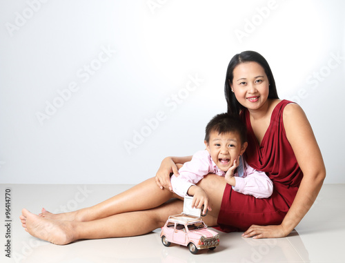 Beautiful Mother And Son playing model toy car