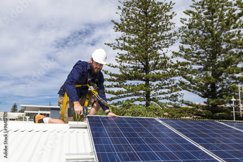 Solar panel technician checking solar panels