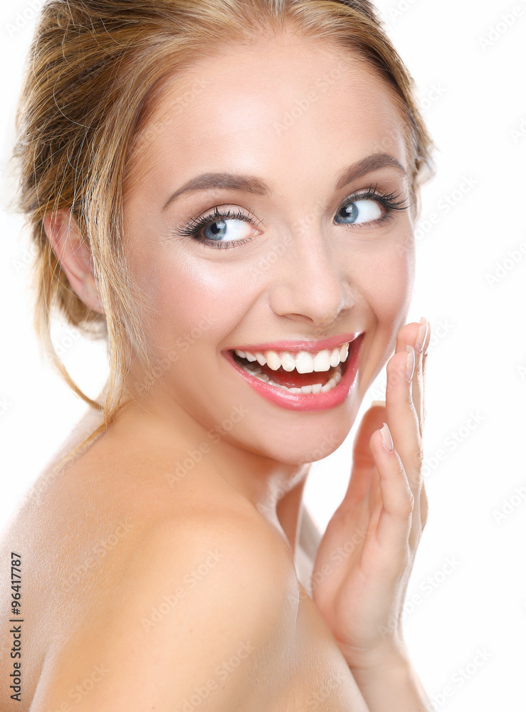 Young woman touching her face isolated on white background Young woman touching her face isolated on white background