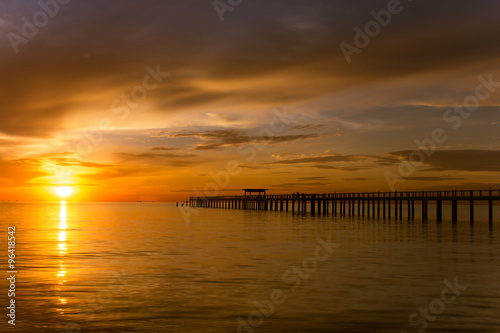 Summer, Travel, Vacation and Holiday concept - Wooden pier betwe photo