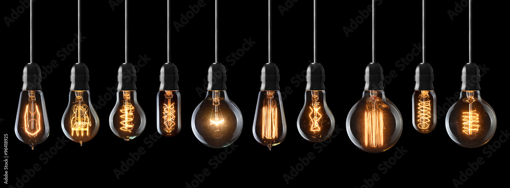 Set of vintage glowing light bulbs on black background - obrazy, fototapety, plakaty 