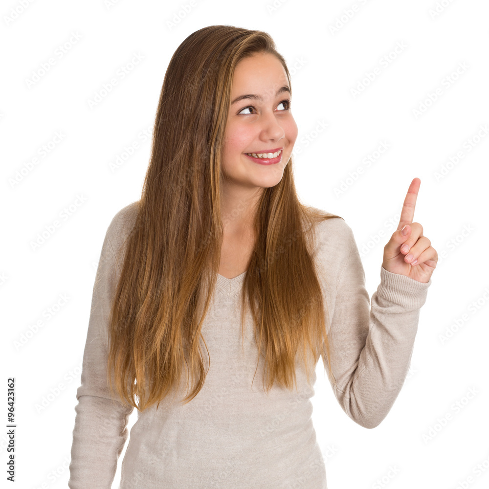 Freundliches Mädchen blickt und zeigt nach rechts oben Freundliches Mädchen blickt und zeigt nach rechts oben