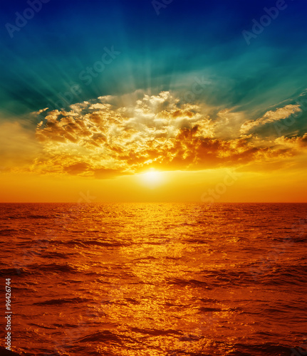 Fototapeta Naklejka Na Ścianę i Meble -  red sunset over sea in clouds