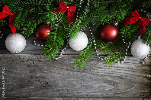Christmas garland on rustic wooden table with copy space