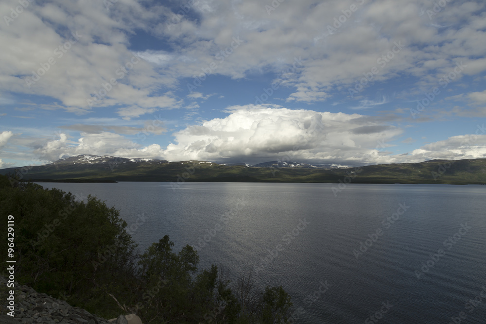 The lake Tornesträsk in north of Sweden and mountains in the background The lake Tornesträsk in north of Sweden and mountains in the background