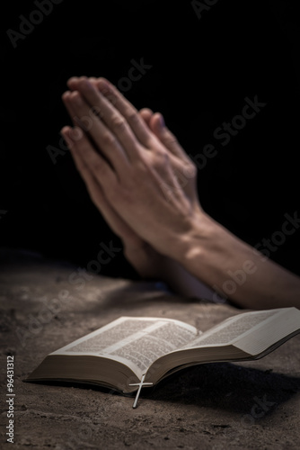 Christian lady with book prays for goodness © Yakobchuk Olena