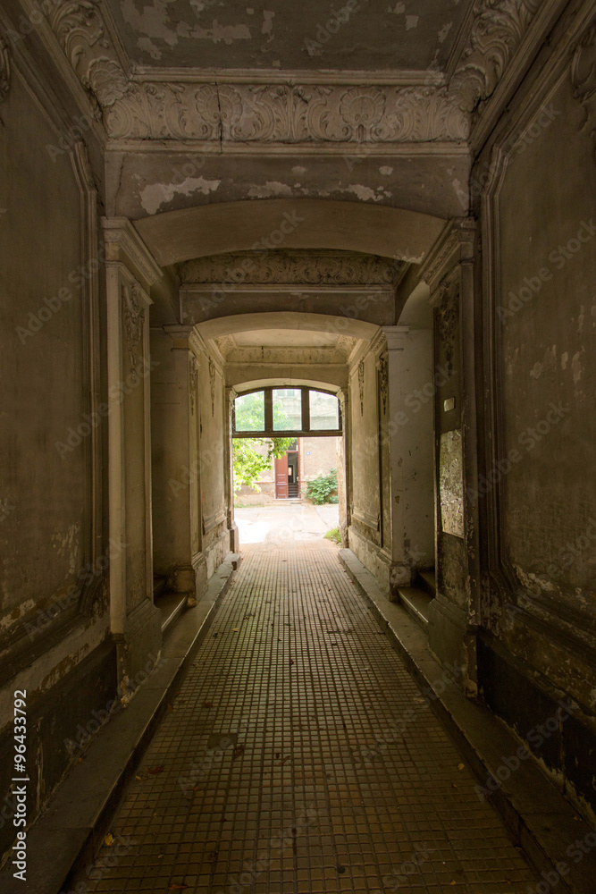 Decayed corridor in an abandoned residential building

